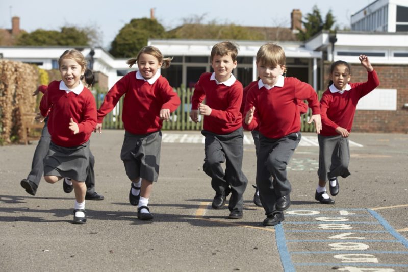 School Children Running in Playground